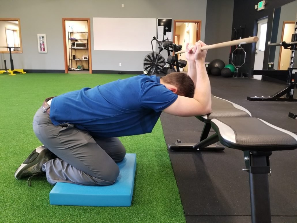 kneeling lat pose Health Niche